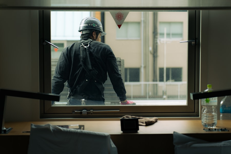 Construction worker installing a window